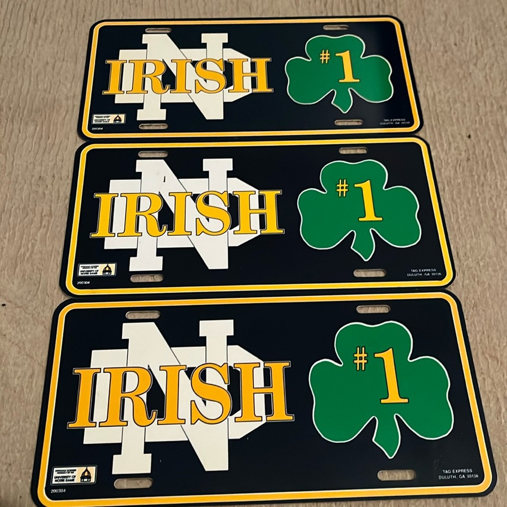 Set of three Notre Dame booster license plate tags